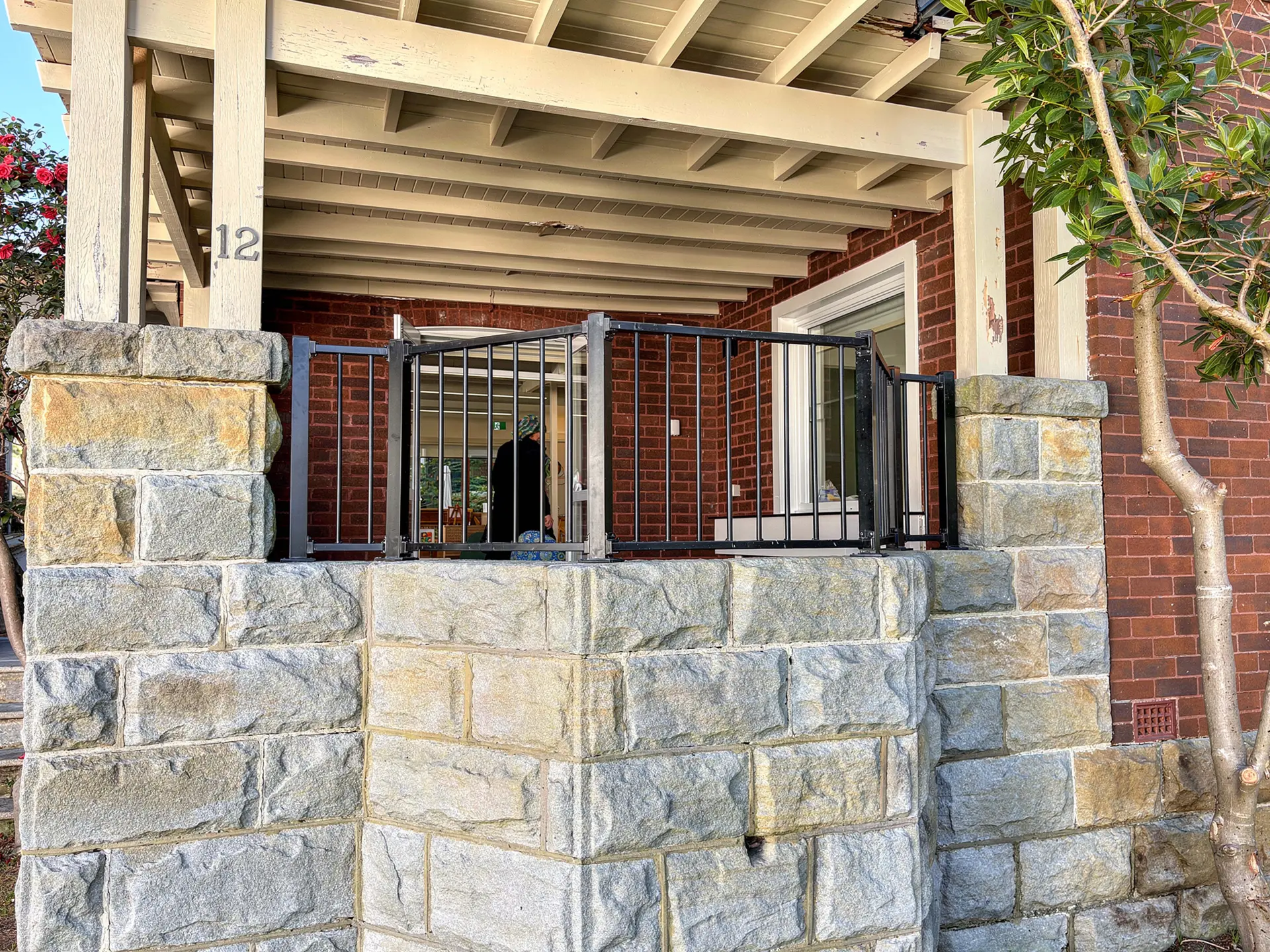 Black metal balustrade front porch.