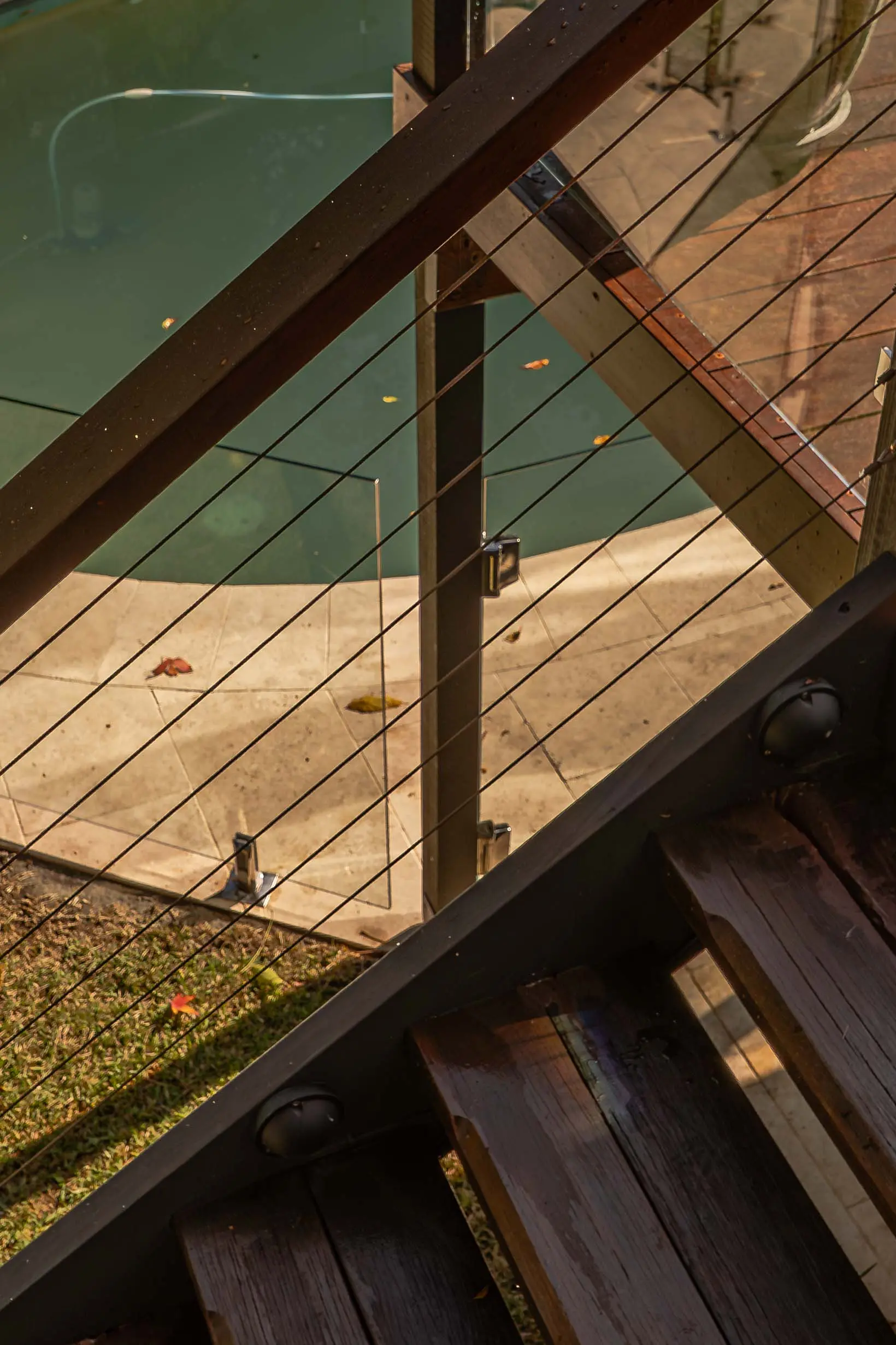 Glass balustrade staircase overhead.