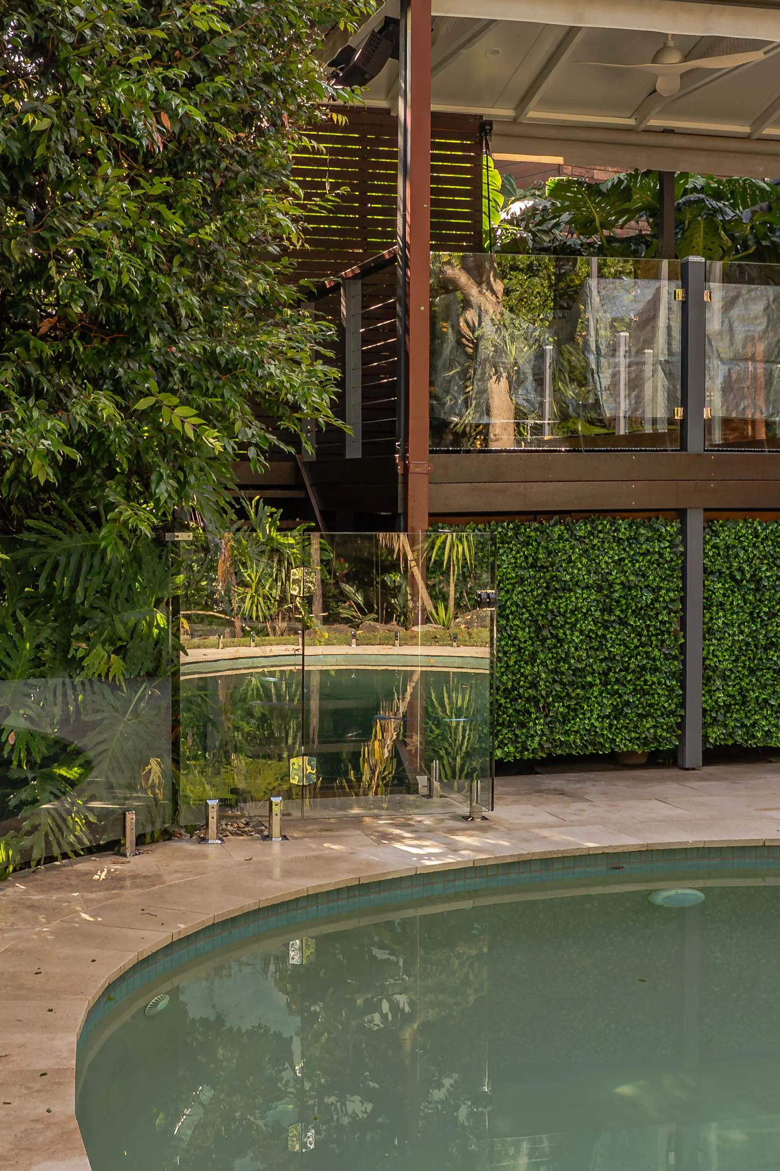 Glass pool fence covered terrace.