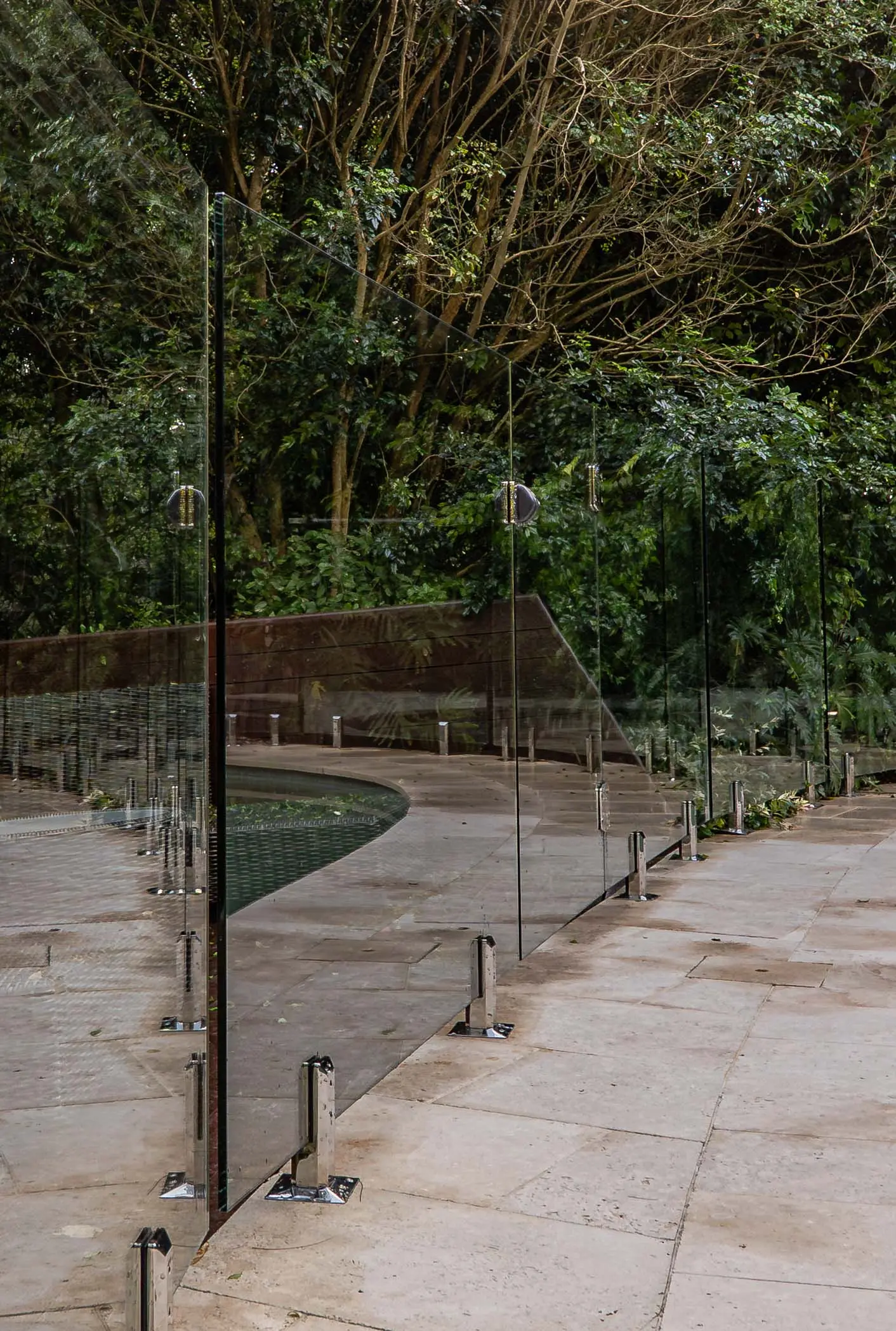 Glass pool fence panel reflection.