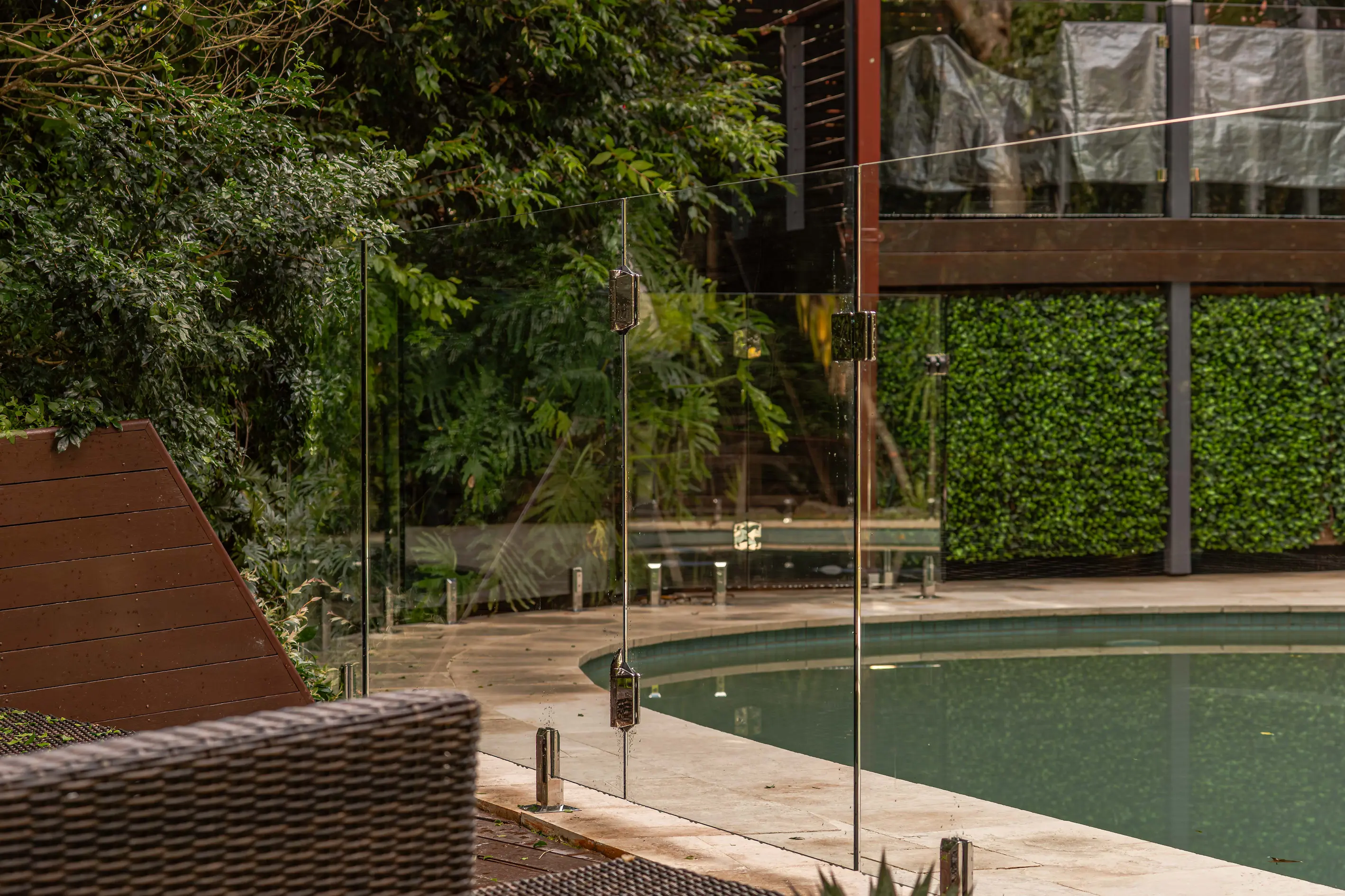 Glass pool fence seating area.