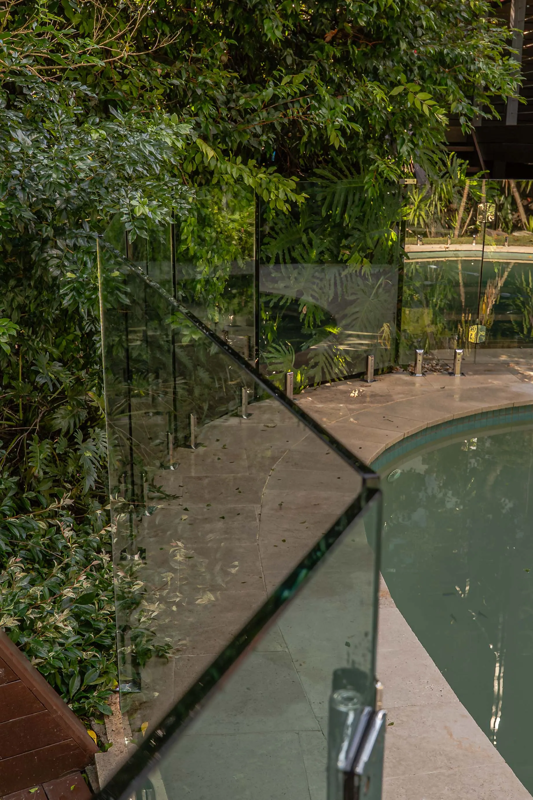 Glass pool fence top edge detail.
