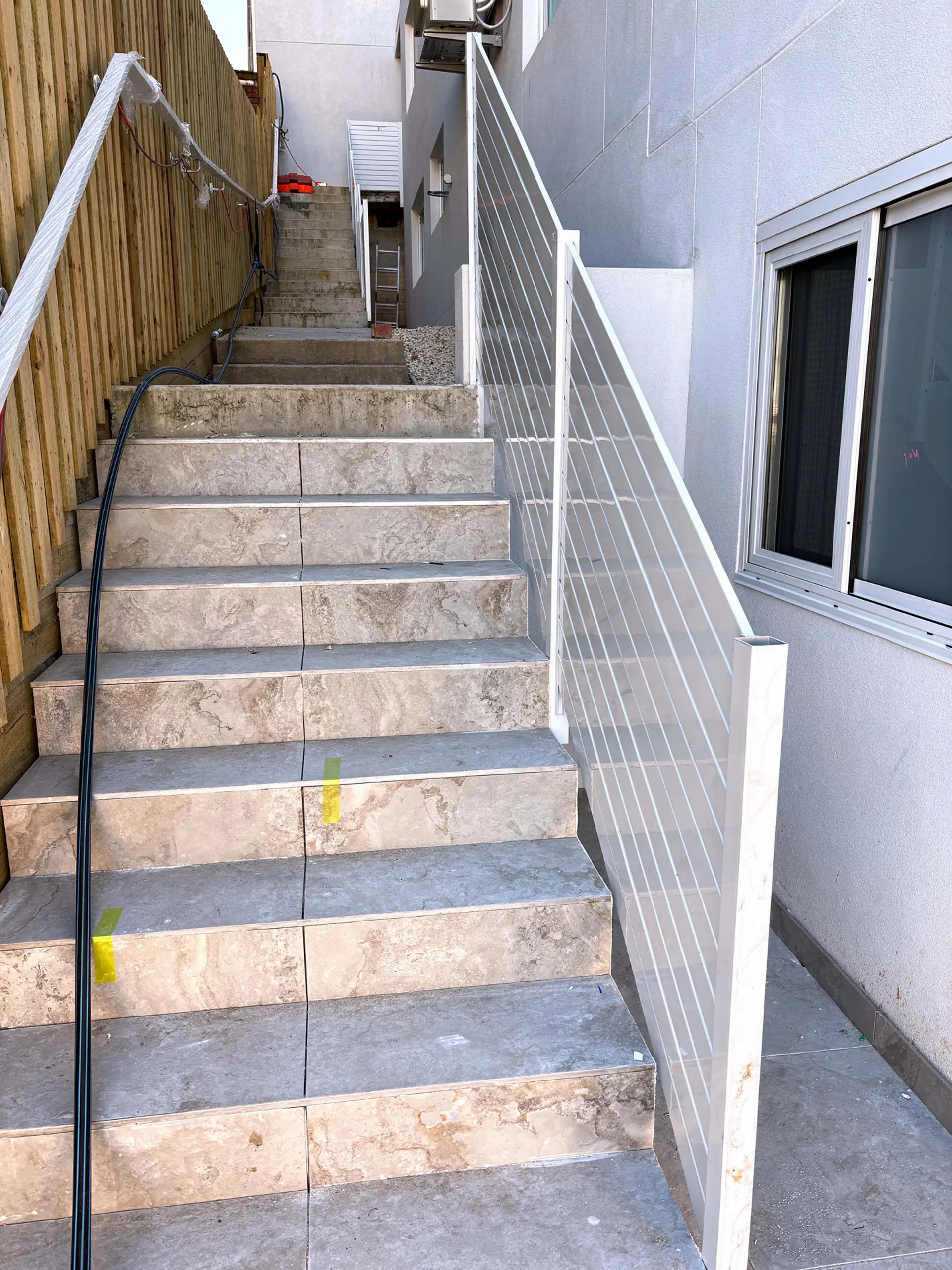 Outdoor stair handrail side passage.