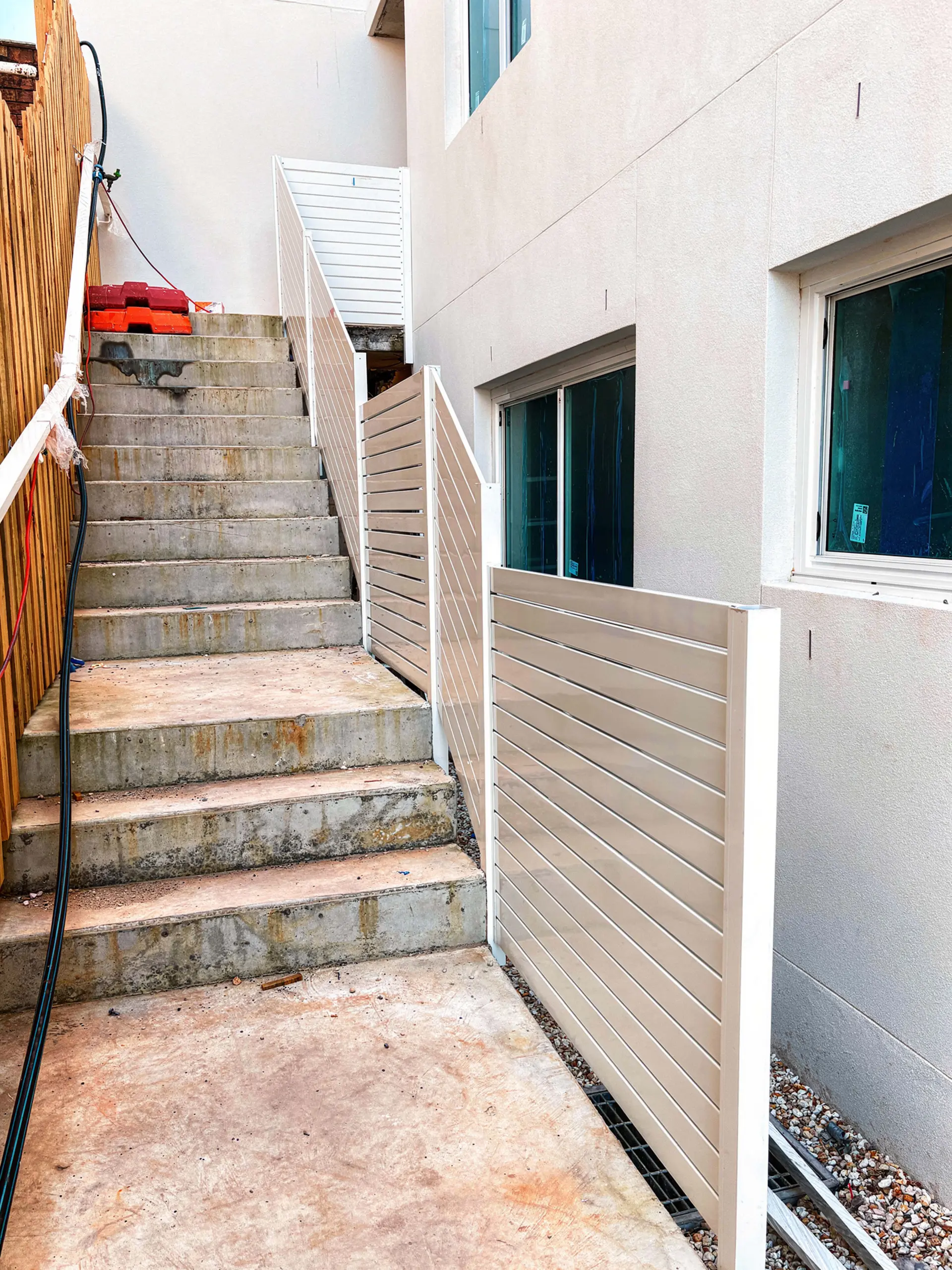Outdoor stair handrail upper flight.