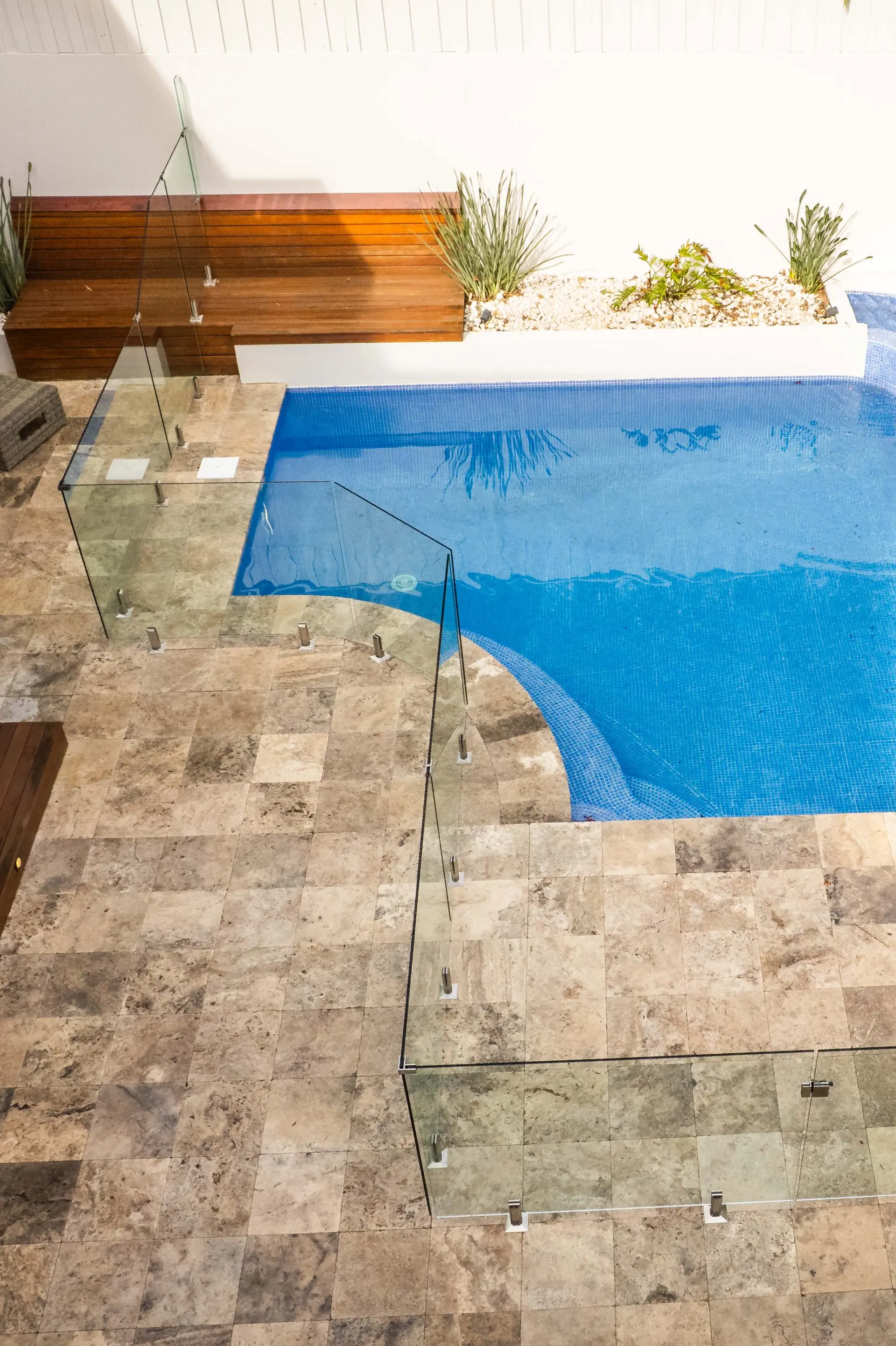 Glass pool fence bench overhead.