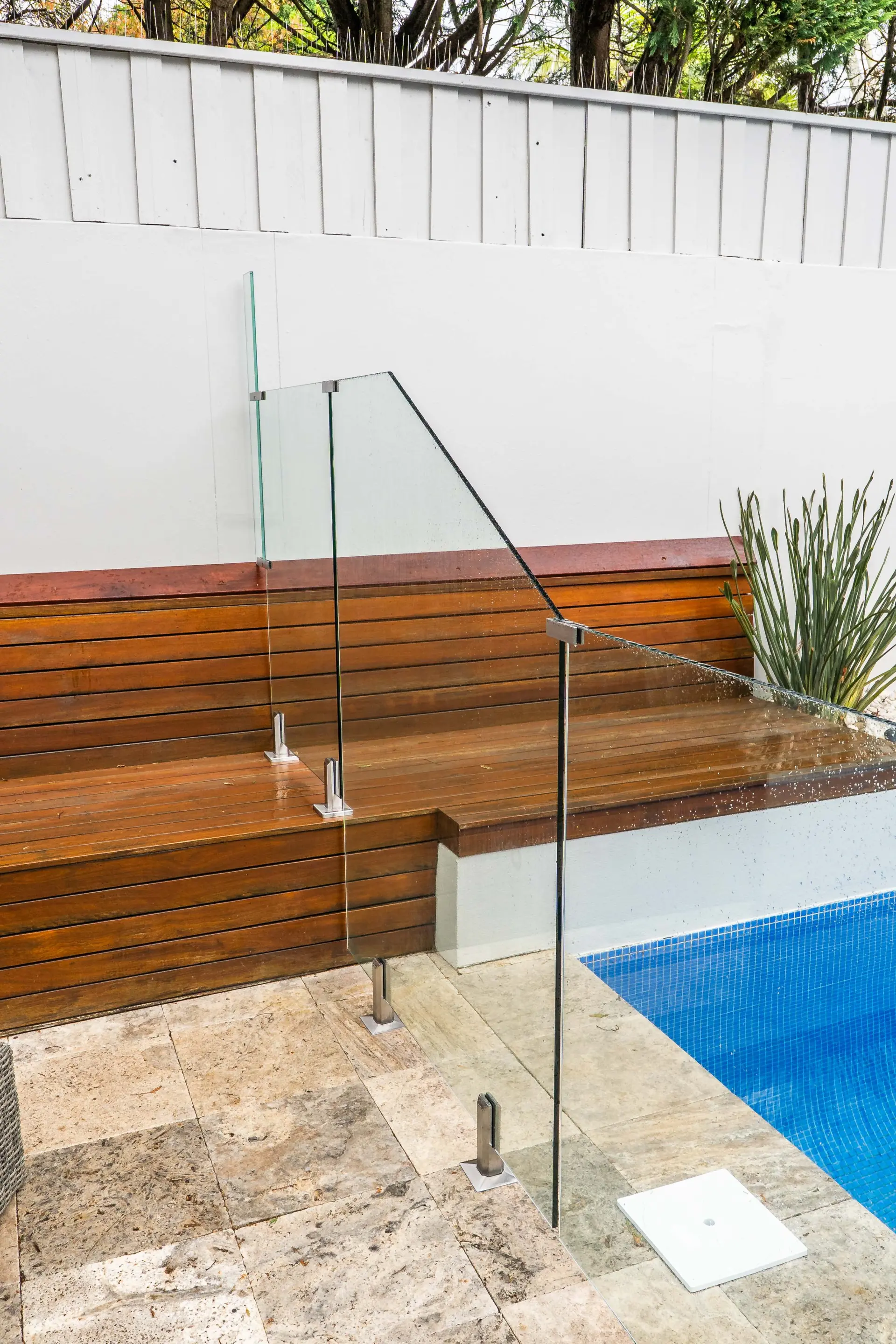 Glass pool fence bench side.