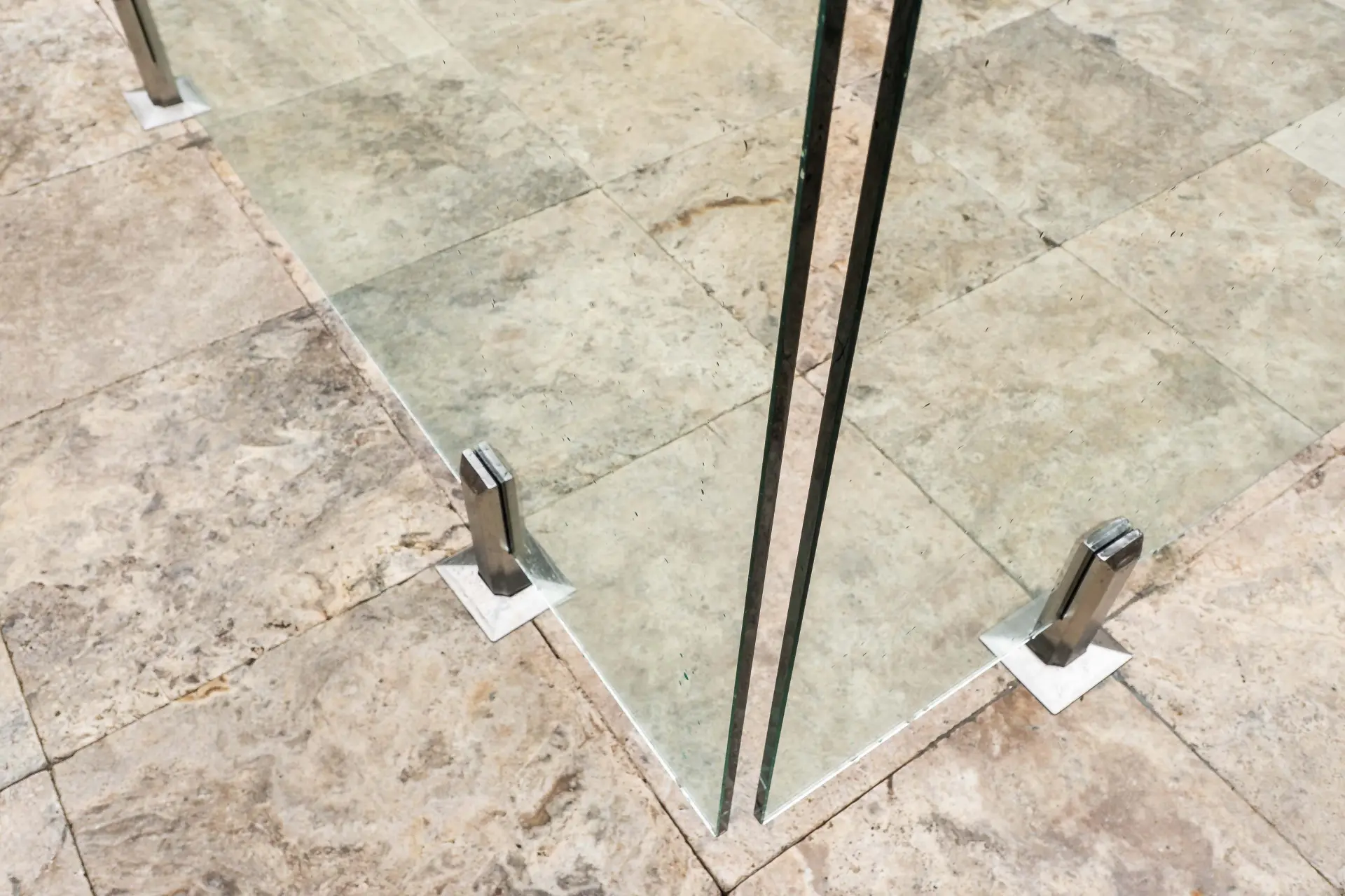 Glass pool fence corner spigots.