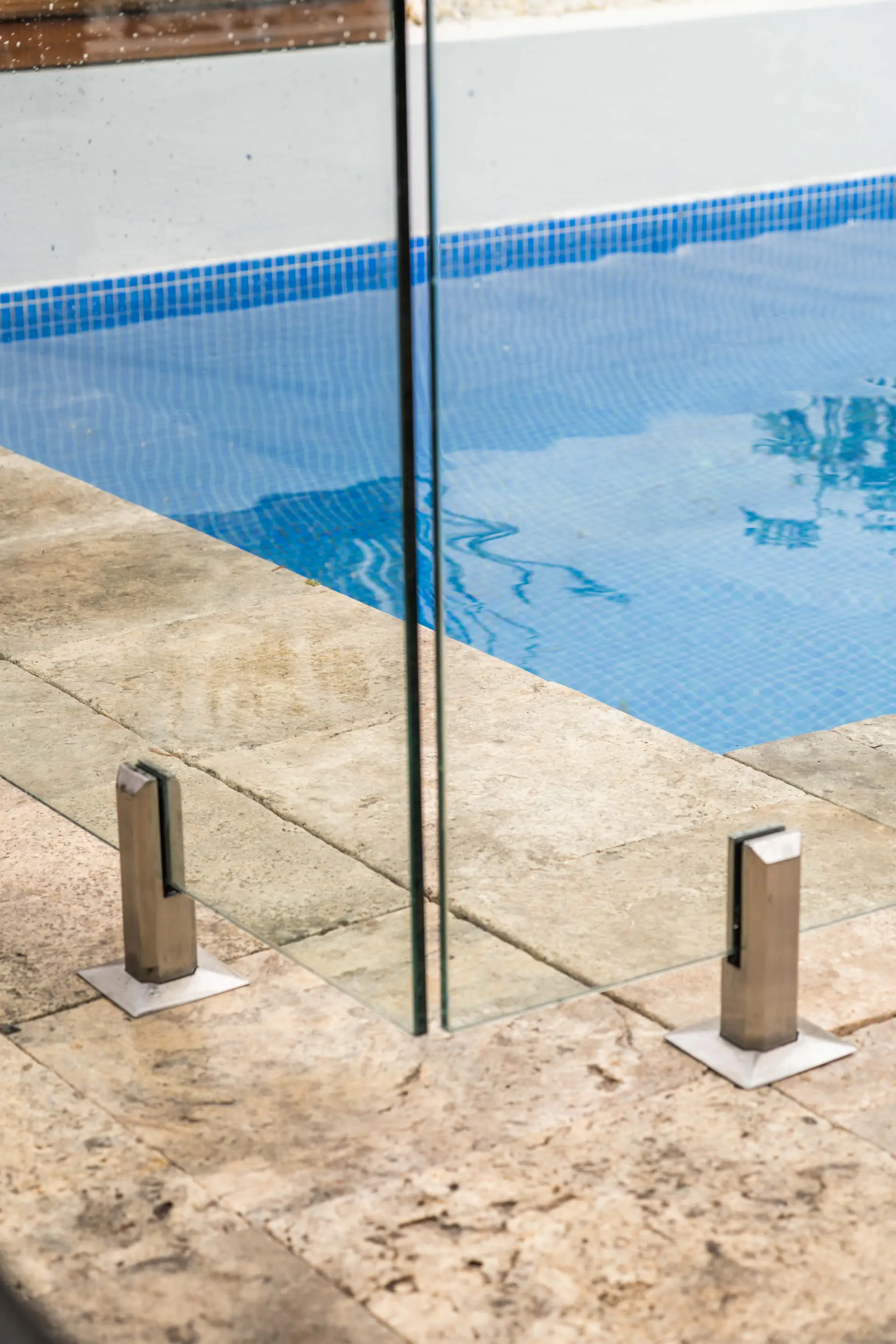 Glass pool fence panel joint.