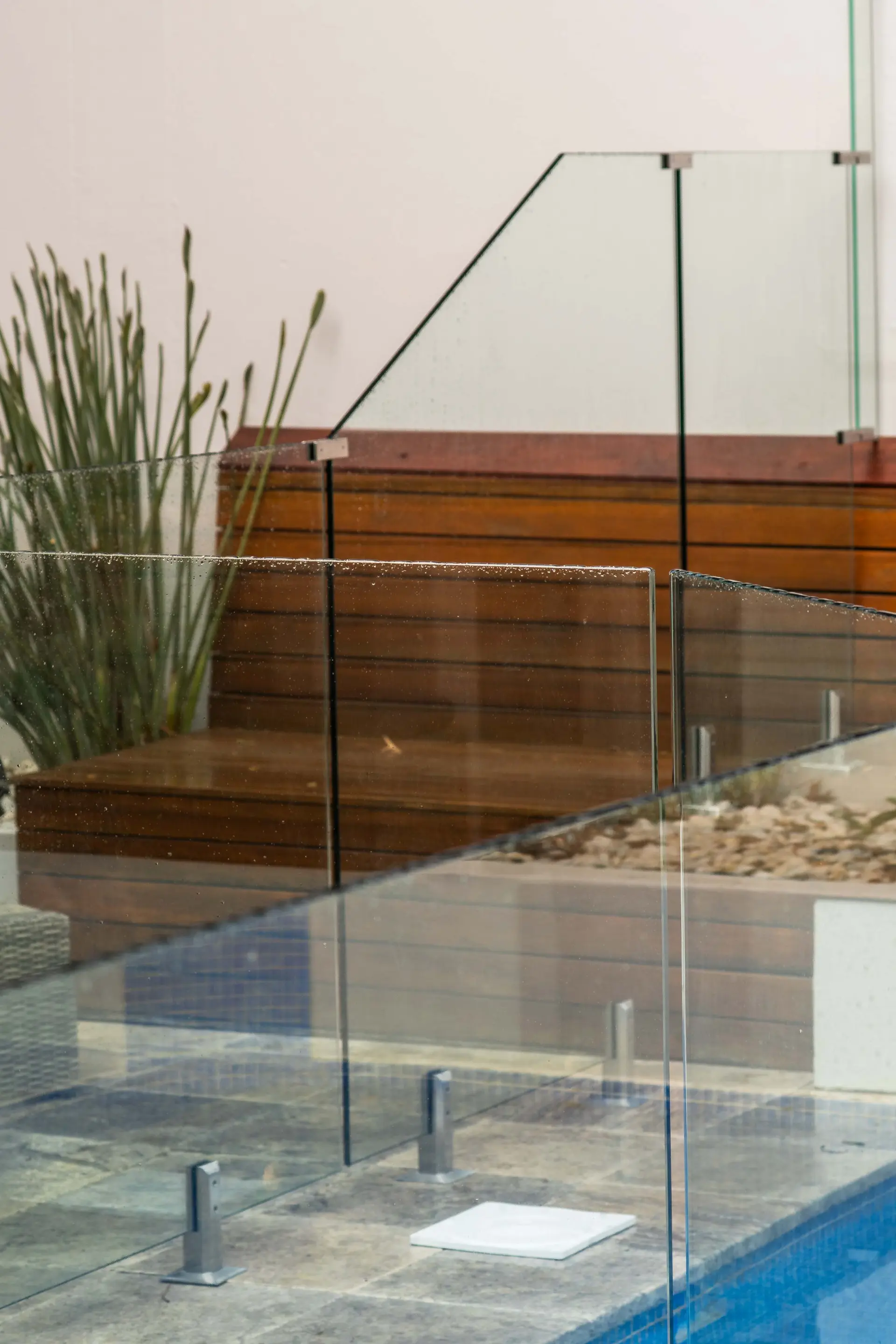 Glass pool fence panel top edge.