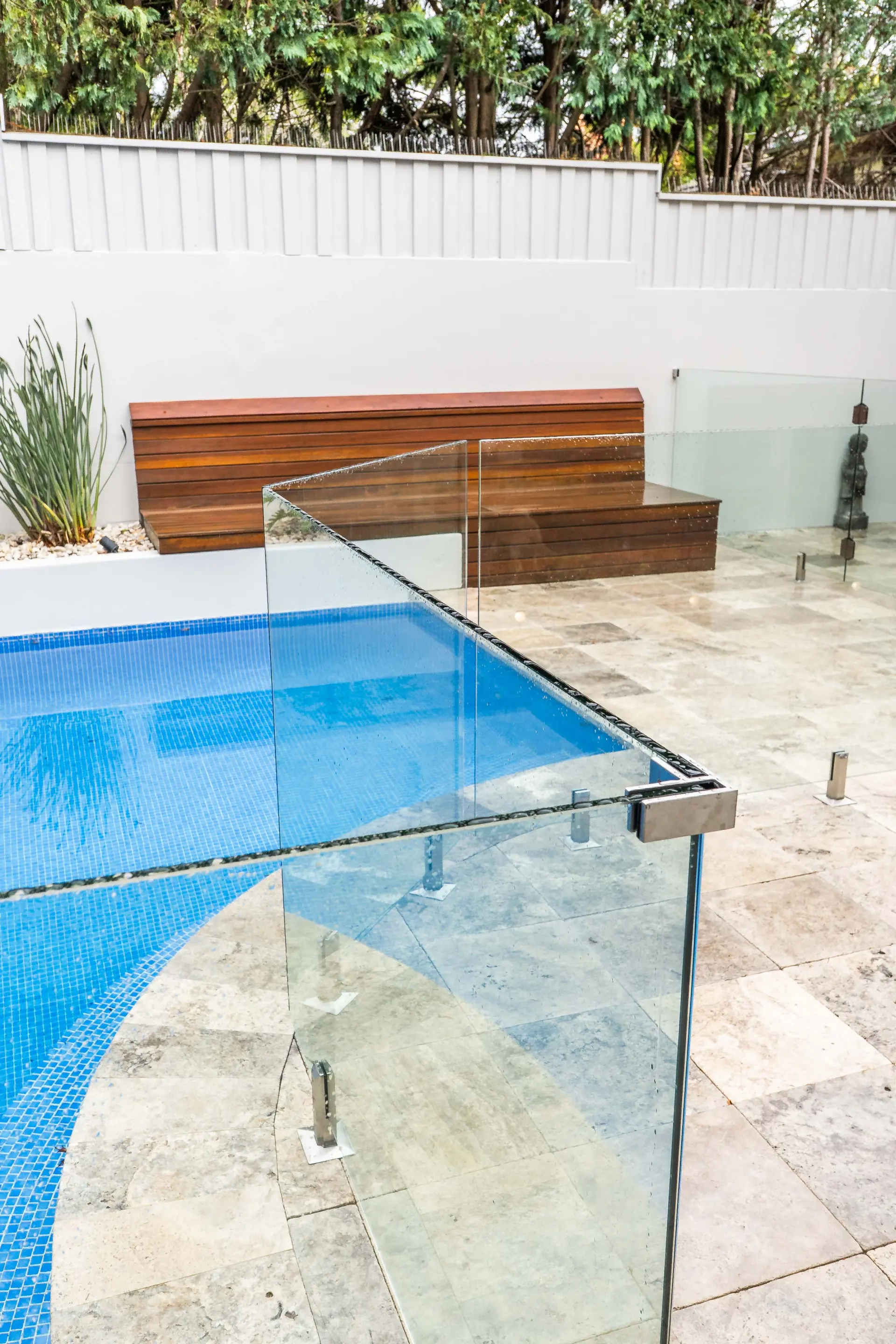 Glass pool fence timber bench.