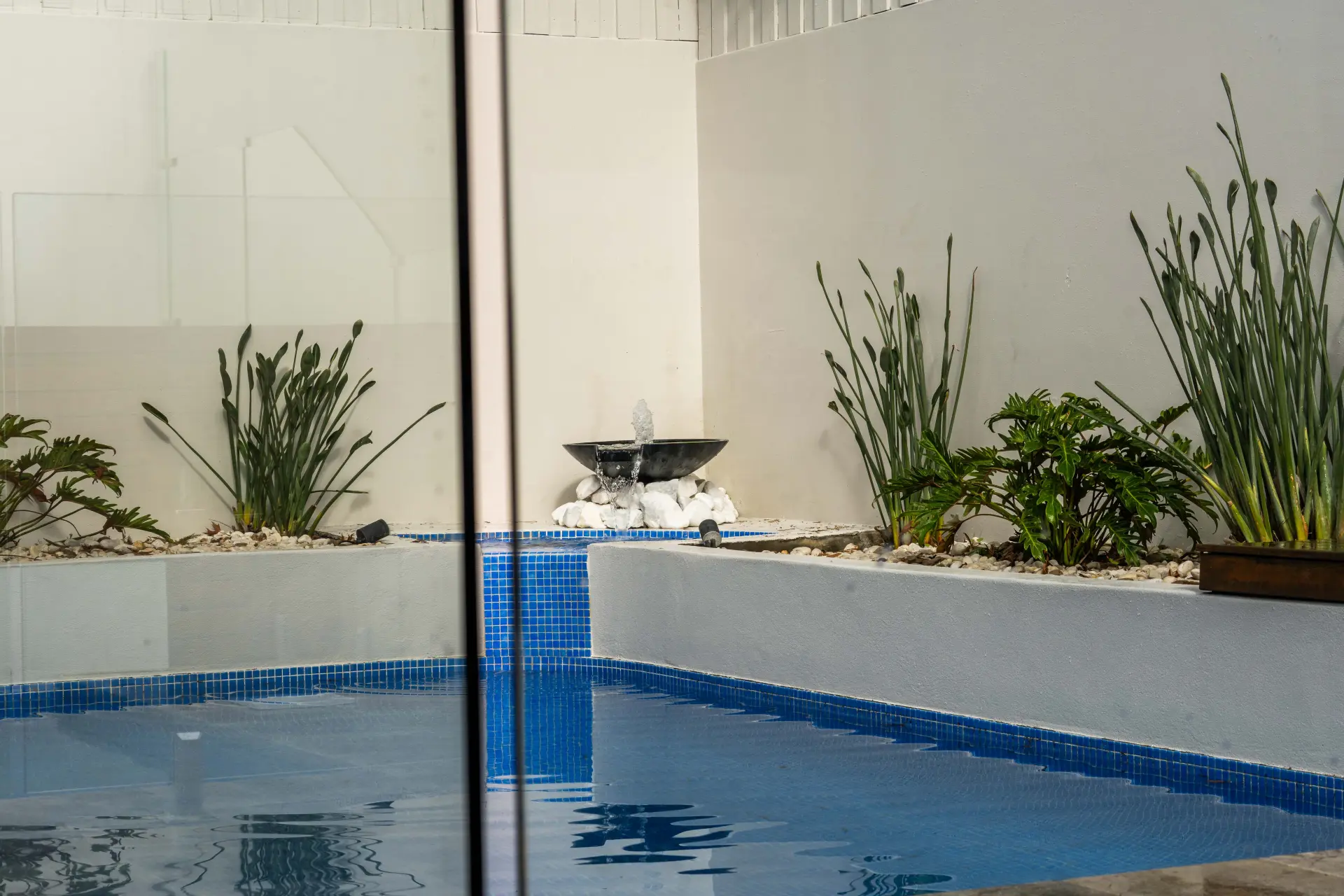 Glass pool fence water feature wide.