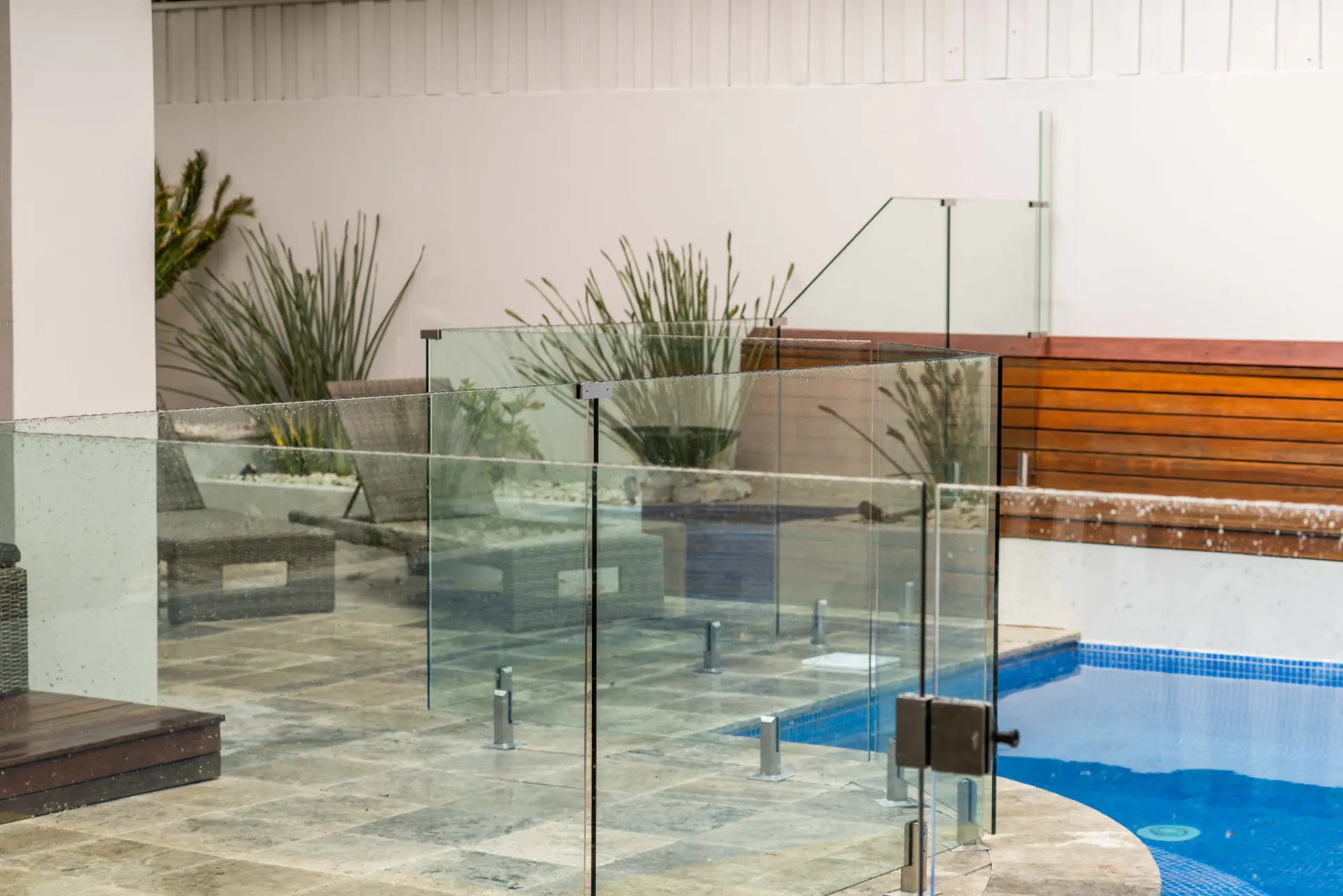 Glass pool gate courtyard wide.