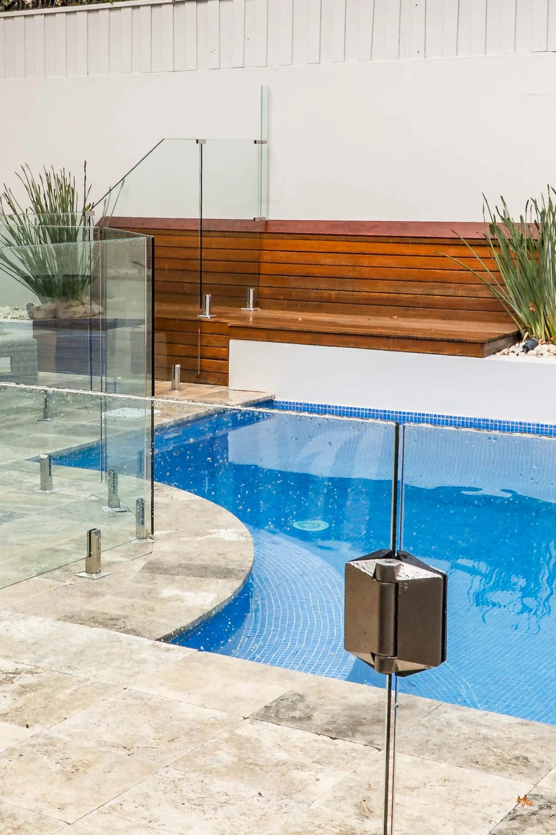 Glass pool gate poolside.