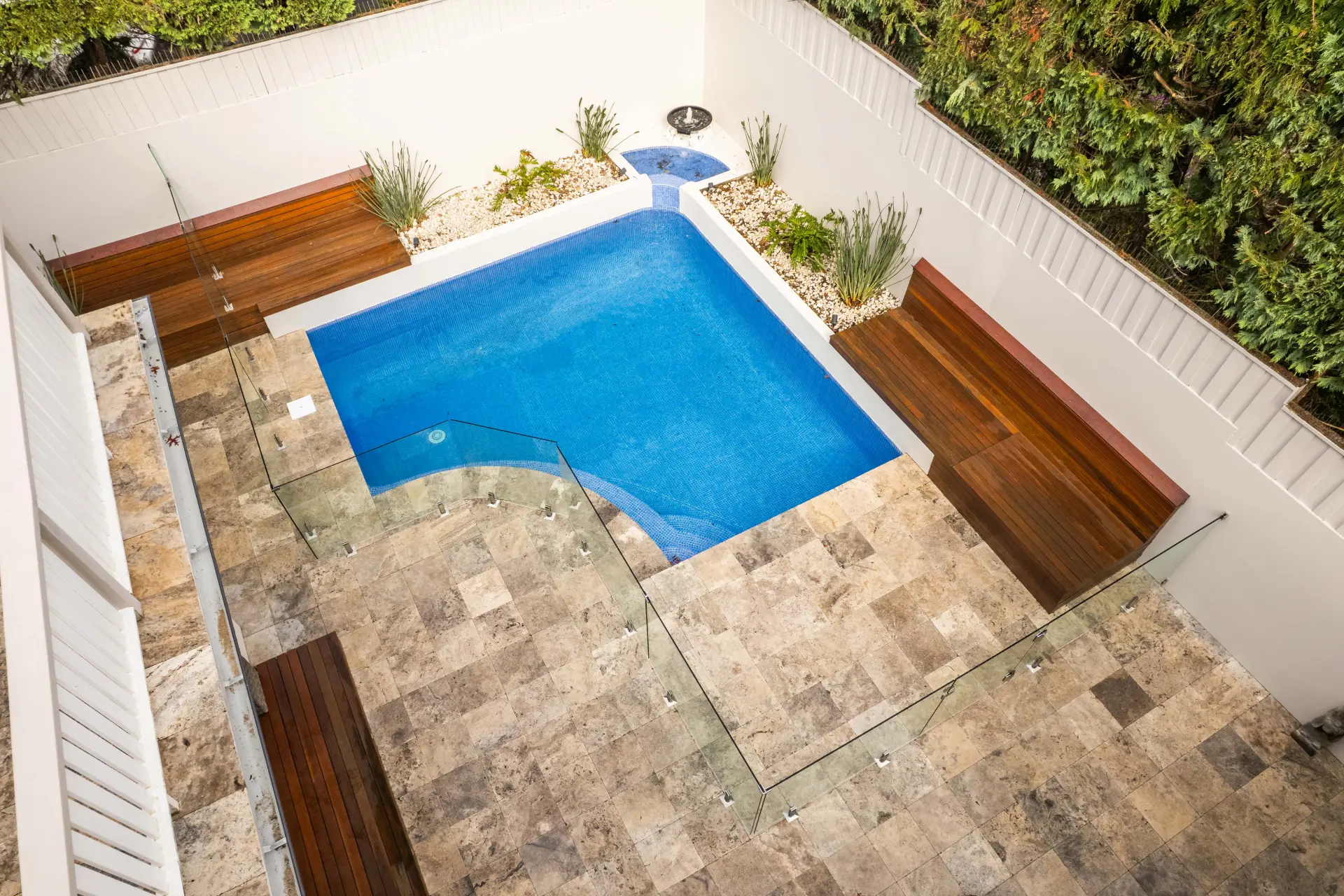Pool glass fencing aerial wide.
