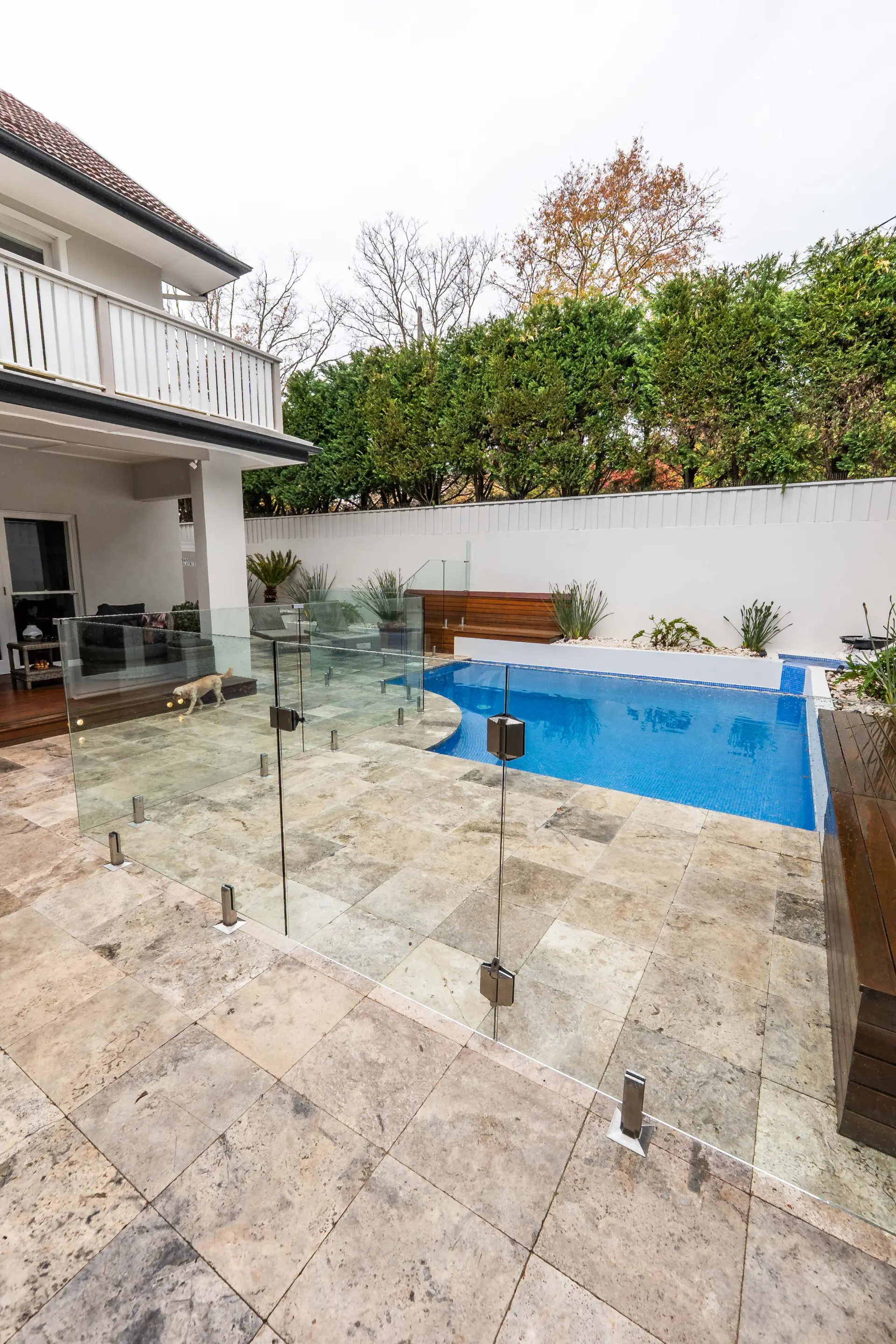 Pool glass fencing house portrait.
