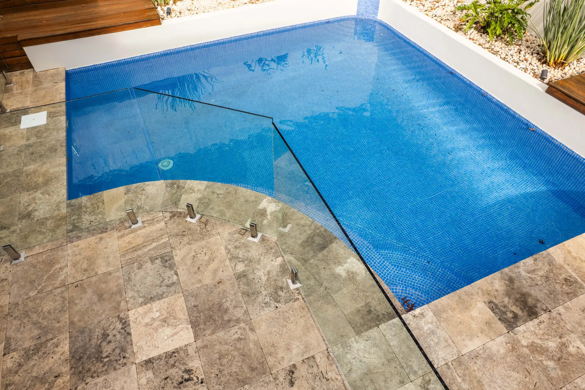 Pool glass fencing overhead water.